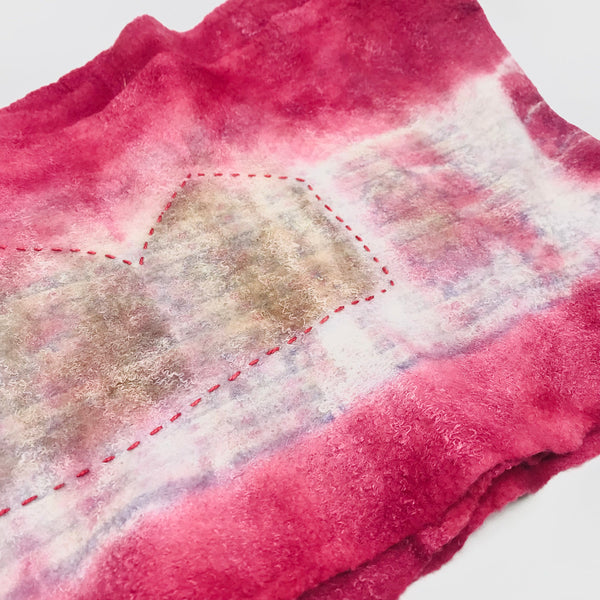 Pink scarf, created with hand-dyed silk and merino wool with recycled materials.