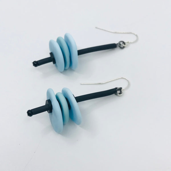 Earrings of flat glass beads with black rubber cord, from the Stack series. 