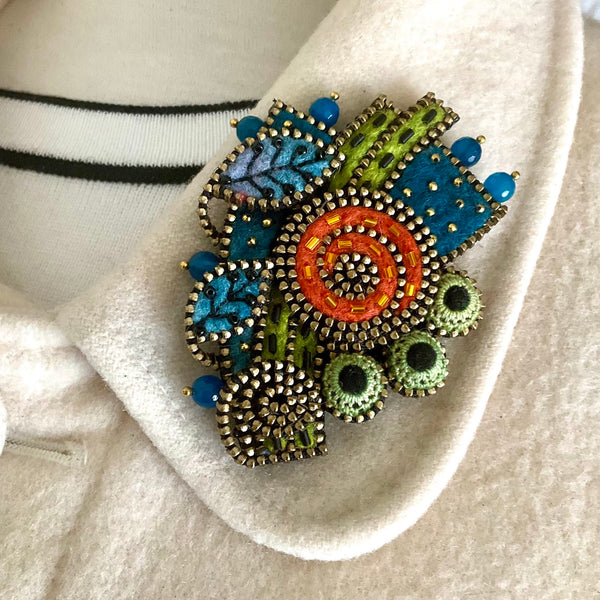 Orange Swirl with Blue Leaves Mixed Media Brooch by Odile Gova