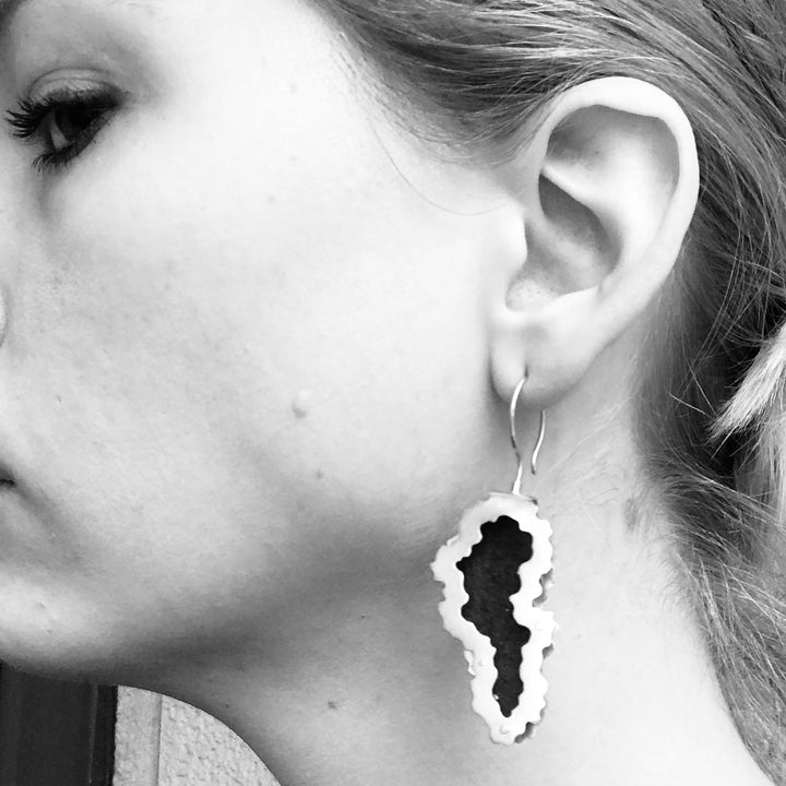 Matière Risiduelle. Dangling earrings of sterling silver and rust in organic forms. 