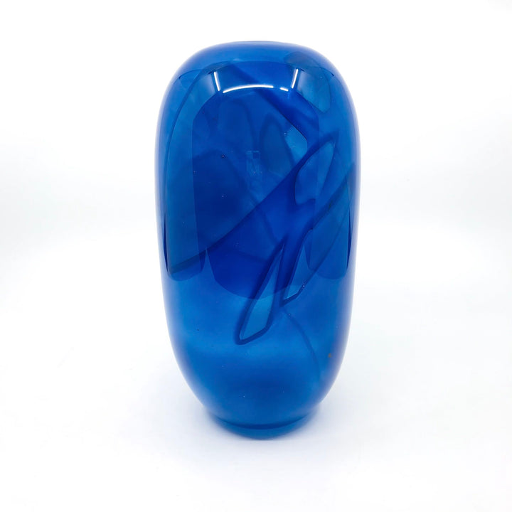 Shadow Vase Series: tall blue glass vessel with shards captured within the layers of the glass, 9.5" x 4.75". 