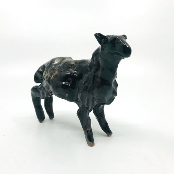 Black Sheep, small ceramic sculpture, 14l x 12h x 4 cm.