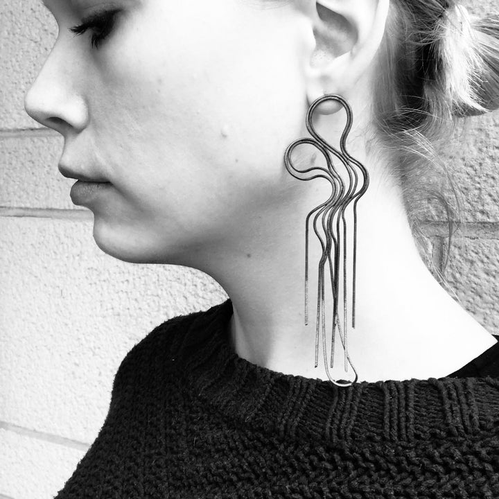 Large and light earrings of repurposed snake chain, with steel posts.