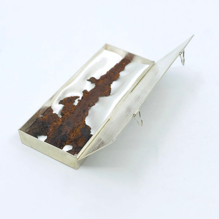 Contorsion scotomitique box. Sterling silver, rust, and satin. 