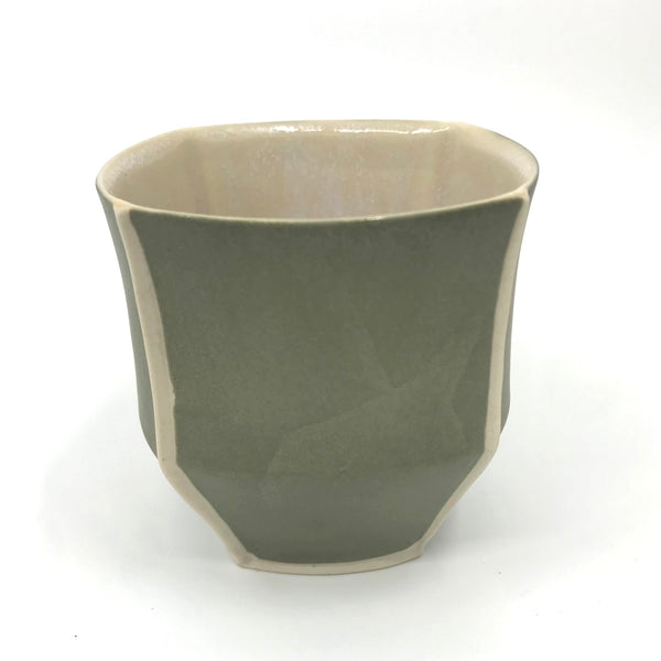 Small slip-cast porcelain cup by  Nicolette Keaney