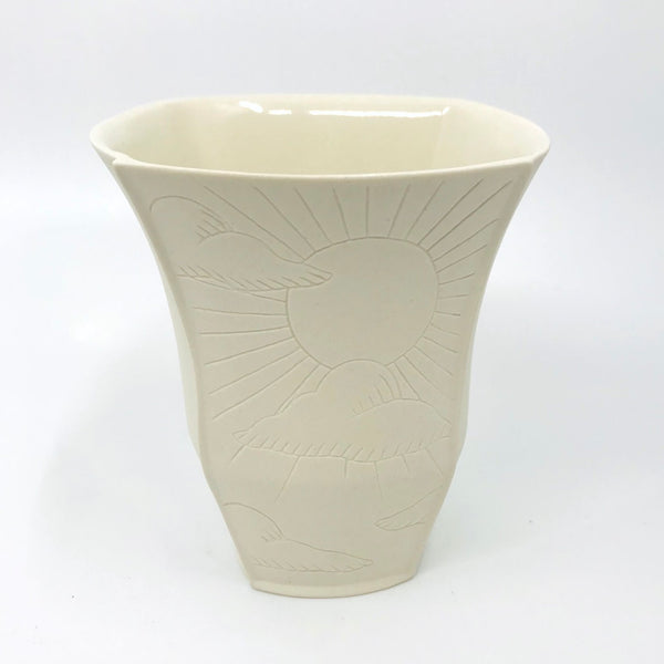 Tall slip-cast porcelain&nbsp;cup, with illustrated details etched onto two of the four exterior sides