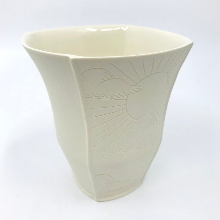 Tall slip-cast porcelain&nbsp;cup, with illustrated details etched onto two of the four exterior sides
