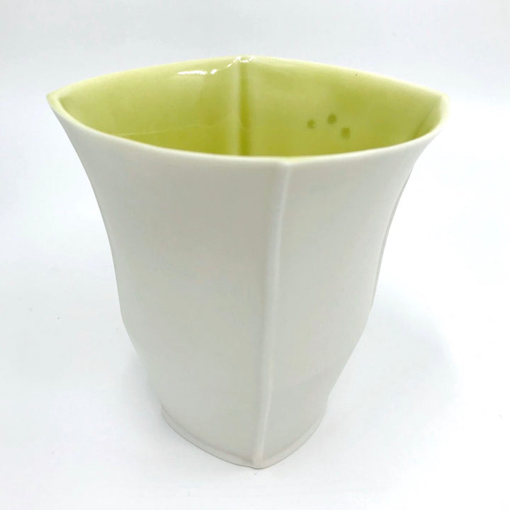Tall slip-cast cups of translucent porcelain