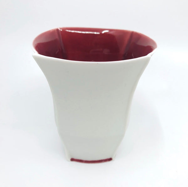 Tall slip-cast cup of translucent porcelain