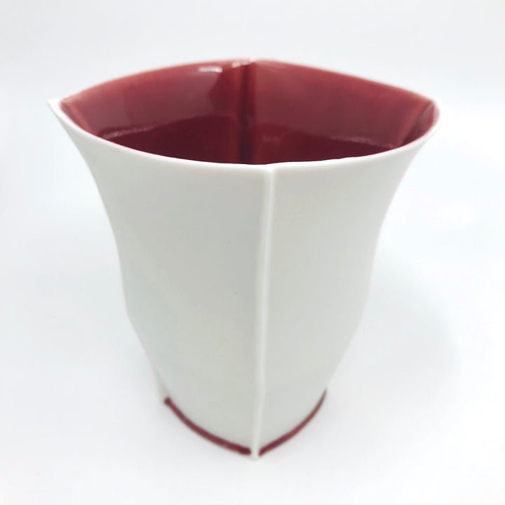 Tall slip-cast cup of translucent porcelain