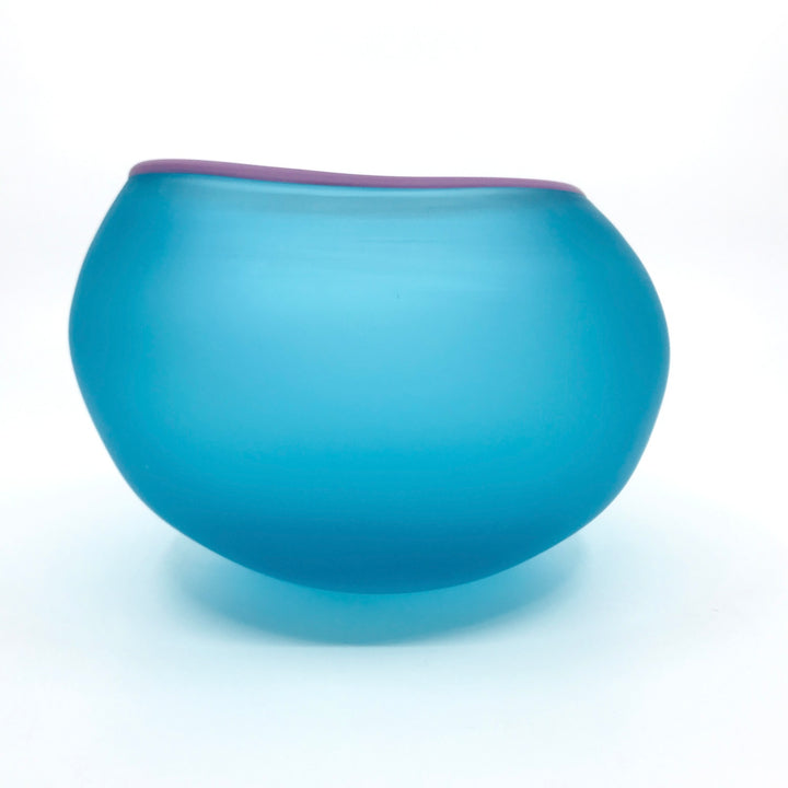 Supernatural bowl in aqua blue, with lavender purple rim. 18 x 16 x 11.5 cm.