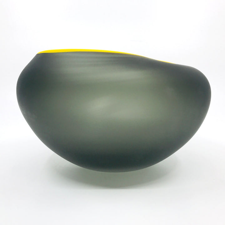 Supernatural bowl in grey, with yellow rim. 18 x 18 x 10.5 cm.
