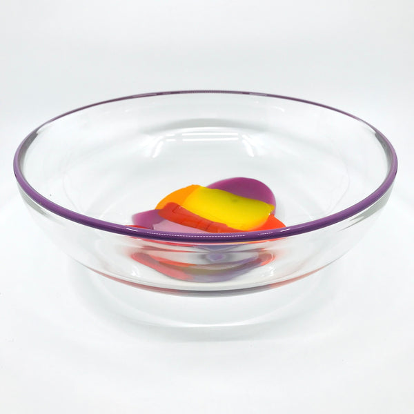 Storm Bowl of hand blown glass. One of a kind bowl in warm tones of purple, red, and yellow. 27 x 27 x 9.5 cm.