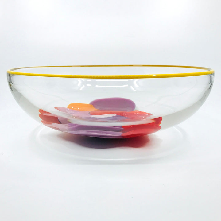 Storm Bowl of hand blown glass. One of a kind bowl in warm tones of purple, red, and orange. 25.5 x 25.5 x 9 cm.