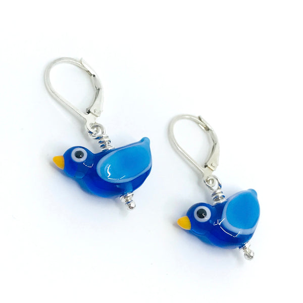 Flame-worked glass bird earrings in blue.