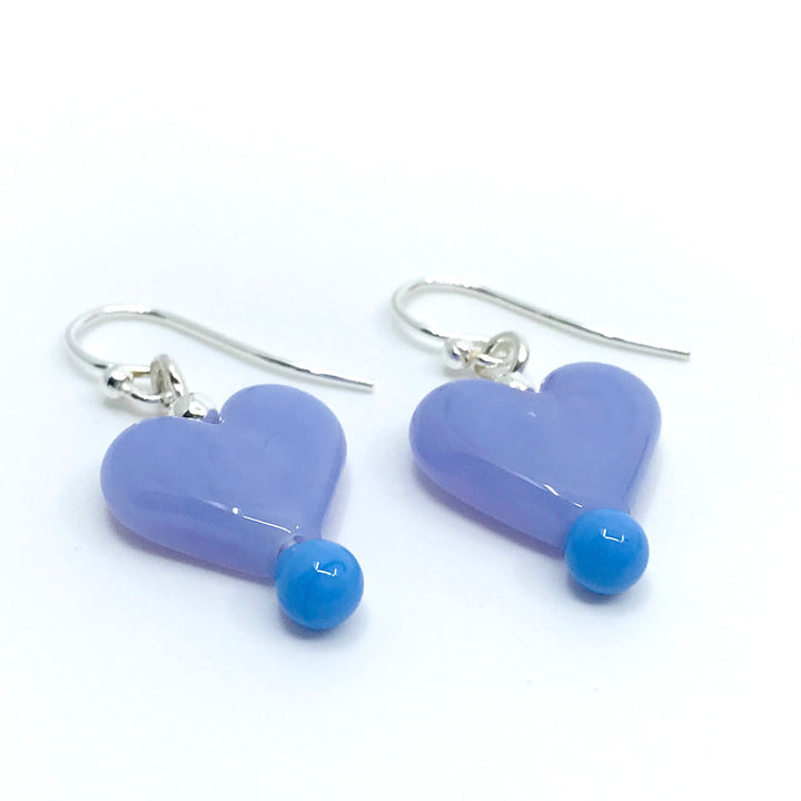 Flame-worked glass heart earrings in purple.