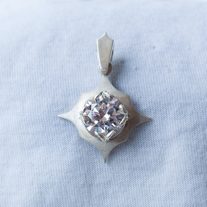 Silver pendant with a clear stone 