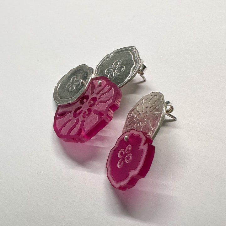 Jellyfish Earrings, 2023.  Large and light asymmetrical stud earrings in sterling silver and acrylic.