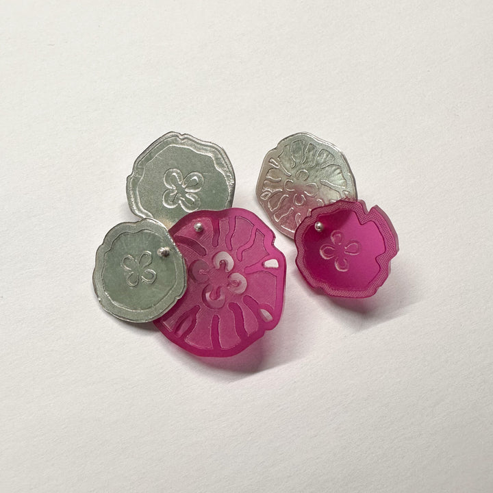 Jellyfish Earrings, 2023.  Large and light asymmetrical stud earrings in sterling silver and acrylic.