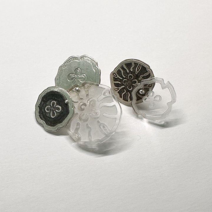 Jellyfish Earrings, 2023.  Large and light asymmetrical stud earrings in sterling silver and acrylic.