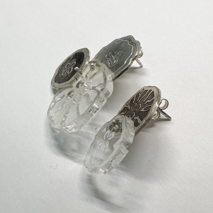 Jellyfish Earrings, 2023.  Large and light asymmetrical stud earrings in sterling silver and acrylic.