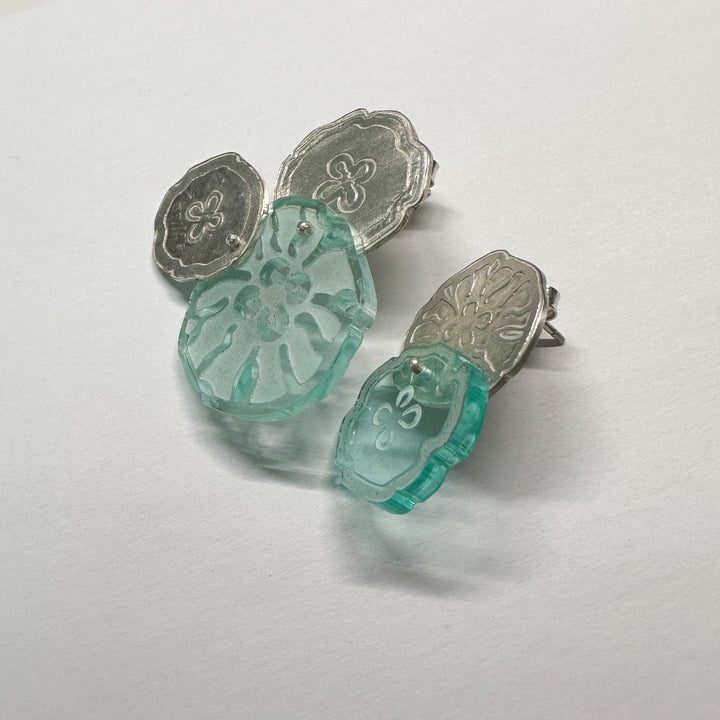 Jellyfish Earrings, 2023.  Large and light asymmetrical stud earrings in sterling silver and acrylic.