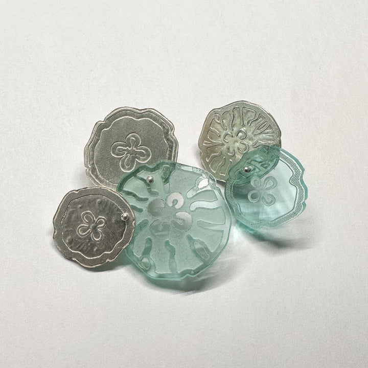 Jellyfish Earrings, 2023.  Large and light asymmetrical stud earrings in sterling silver and acrylic.