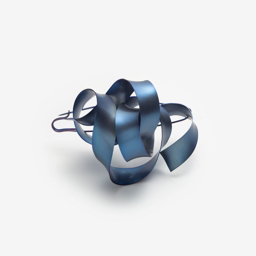 Ribbon (L.2) in icy blue titanium. 60mm X 80mm