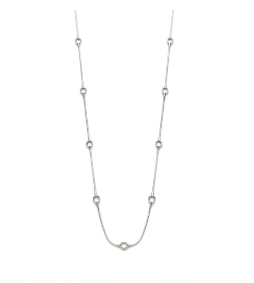 Sautoir Kabis: long necklace of sterling silver chain dotted with round hollow forms. Natural finish, and measuring 32".