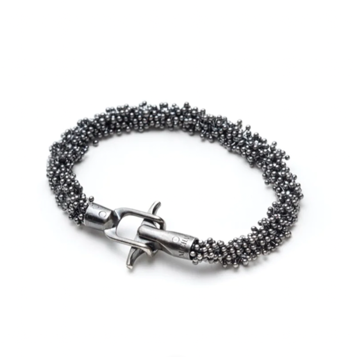 The oxidized silver ShikShok bracelet has a beautiful heft to it. The oxidation brings out gray-petroleum blue reflections in the metal. 7.5" or 20 cm long, and with a specially designed magnetic clasp for extra safety.