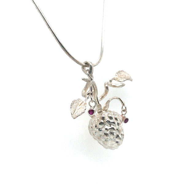 Silver necklace with raspberry-shaped pendants on a white background