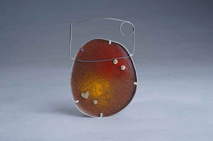 Mom's love #1 brooch, 2023.  Created with fabrication, cloisonné enamel on copper, and basel setting, this brooch is made of copper, silver, brass, steel wire, found object (five-finger peach,五指毛桃), and Zhengdan paper.   2.9x2x0.4 inches