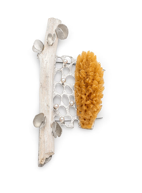 Brooch with natural elements including a piece of wood and a yellow coral-like sponge