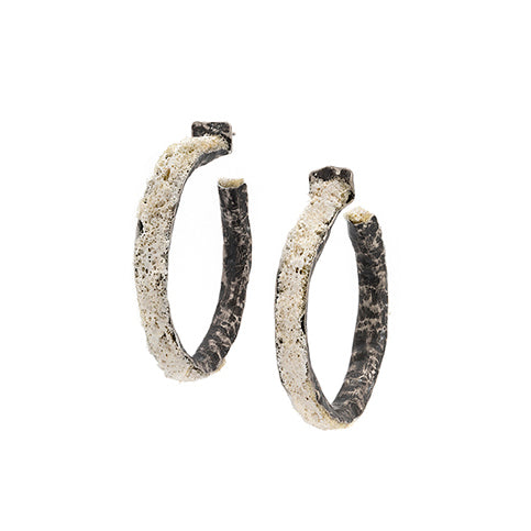 Pair of textured hoop earrings on a white background
