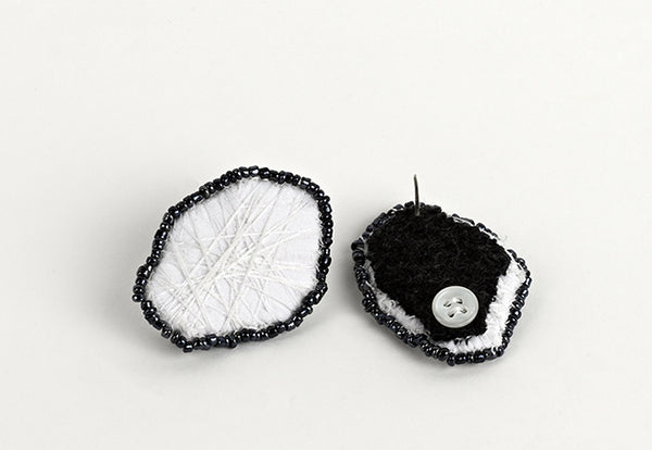 Black and white embroidered earrings