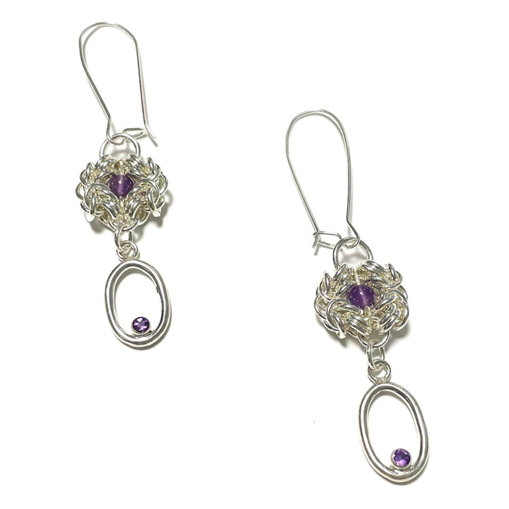Murky Warrior (玄武), 2023.  This hand fabricated set with pauldrons--which can be separated into a neckpiece,  brooches, and earrings--is made from sterling silver, amethyst, amethyst beads, and acrylic. Every part is detachable and can be worn separately.