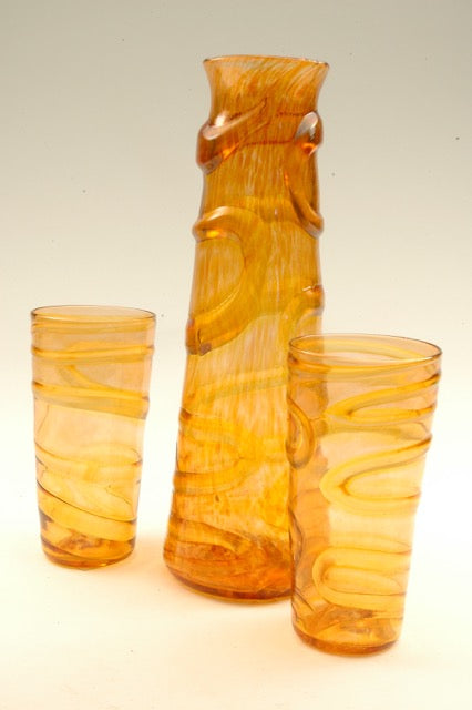 Oxbow decanters/vases refer to the winding paths of rivers. These hand blown glass vessels and the matching tumblers can be used equally as small vases for home or office and make wonderful sets with the matching tumblers or the small xylem cups. 