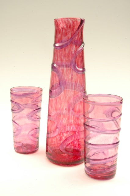 Oxbow decanters/vases refer to the winding paths of rivers. These hand blown glass vessels and the matching tumblers can be used equally as small vases for home or office and make wonderful sets with the matching tumblers or the small xylem cups. 