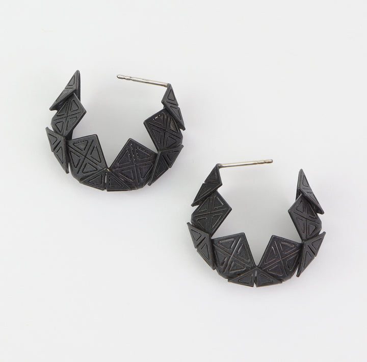 Small Origami Hoops  Stunning geometric forms of laser cut and powder coated brass, with sterling silver posts. Each origami hoop is hand folded.  3x3x1cm, 2023