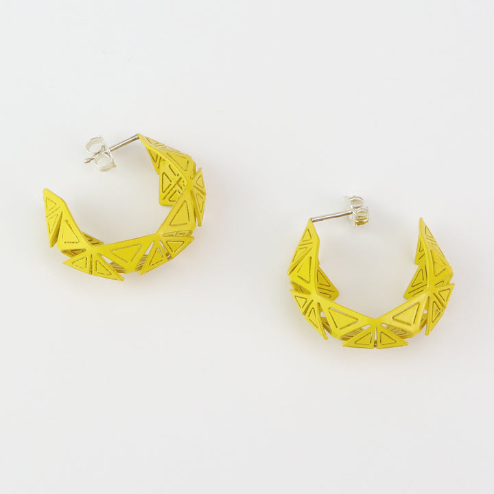 Small Origami Hoops  Stunning geometric forms of laser cut and powder coated brass, with sterling silver posts. Each origami hoop is hand folded.  3x3x1cm, 2023