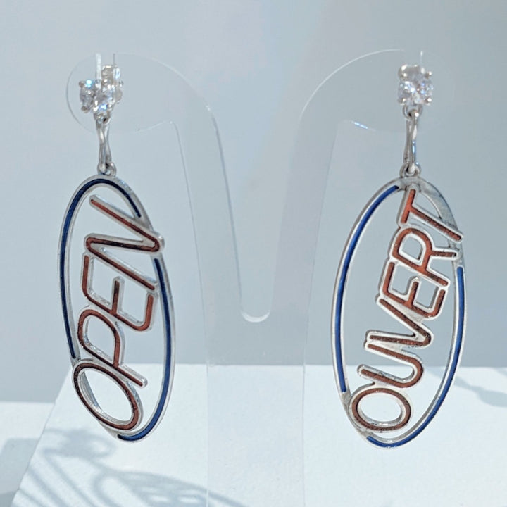 Ouvert/Open Earrings, from the 7 jours Collection. 2022.   Created with 3D design & printing, enamelling, and stone setting, these earrings are made of sterling silver, enamel, and cubic zirconia.  8x3x0.5cm each