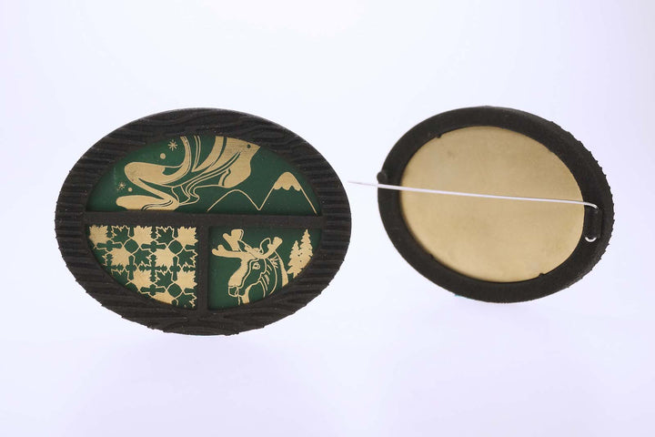 Second hometown: Canada - Treasure Box Brooch, 2023.  Created with 3D printing and laser engraving, this brooch is made of nylon, brass, and spray paint.  6.4x 5x 0.8cm