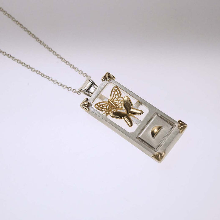 Hometown: Taiwan Duobaoge (curio boxes) - Silver Pendant, 2023.  Created with CAD work (3D modelling), gold plating, and cold connection (riveting), this necklace is made of sterling silver, 18k and 14k yellow gold, and 18k yellow gold plating. The inside elements can be customized.  4.3x1.7x0.8cm on a 24" chain
