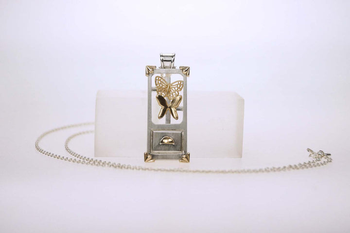 Hometown: Taiwan Duobaoge (curio boxes) - Silver Pendant, 2023.  Created with CAD work (3D modelling), gold plating, and cold connection (riveting), this necklace is made of sterling silver, 18k and 14k yellow gold, and 18k yellow gold plating. The inside elements can be customized.  4.3x1.7x0.8cm on a 24" chain