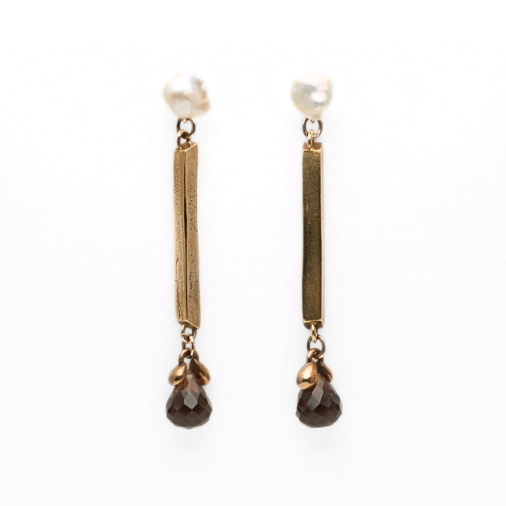 Poutine Earrings, from the 7 jours Collection. 2022.   Created with wax carving and 3D design & printing, these earrings are made of 10k gold, bronze, yellow bronze, pearls, and smoky quartz.