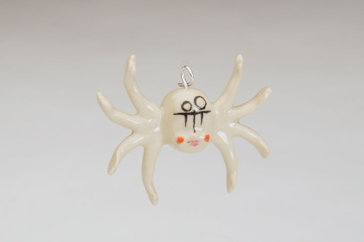 Baby Spider, 2023.  These hand fabricated pendant is made of ceramic, underglaze and clear glaze, china paint, and recycled silver.