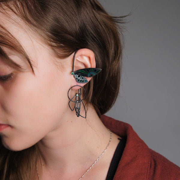 Cicada Wings, 2023.  Created with hand fabrication and enamelling, these earrings are made of sterling silver, fine silver, recycled silver, enamel, and cubic zirconia.  12 x 2.9 x 3cm