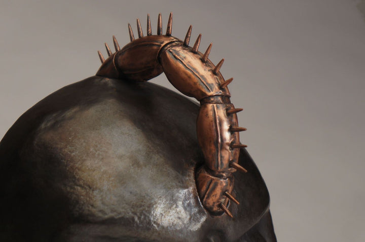 Hothead, 2022.  Created with hand fabrication, chase and repousse, and spiculum forming, this mask is made of copper and silver.  18 x 26 x 14cm