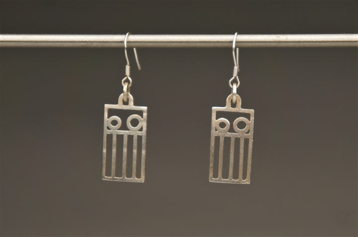 Rectangular Trashland Logo, 2022.  These hand fabricated earrings are made of sterling silver and recycled silver.  4.2 x 1.2 x 0.1 cm