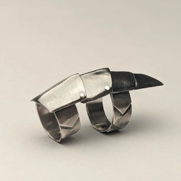 1/2 Finger Snapper Ring by Rayce Min